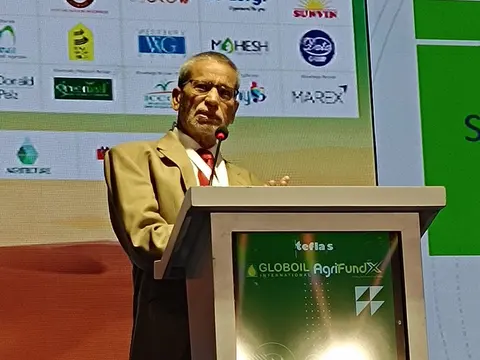 Siraj Hussain speaking at the podium at Globoil AgriFund in Dubai