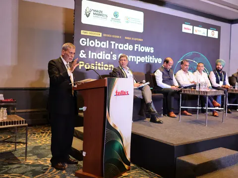 Speaking at the lectern during the panel discussion on Global Trade Flows and India's Competitive Position at the Maize Markets Summit & Expo 2026, with panellists seated on stage
